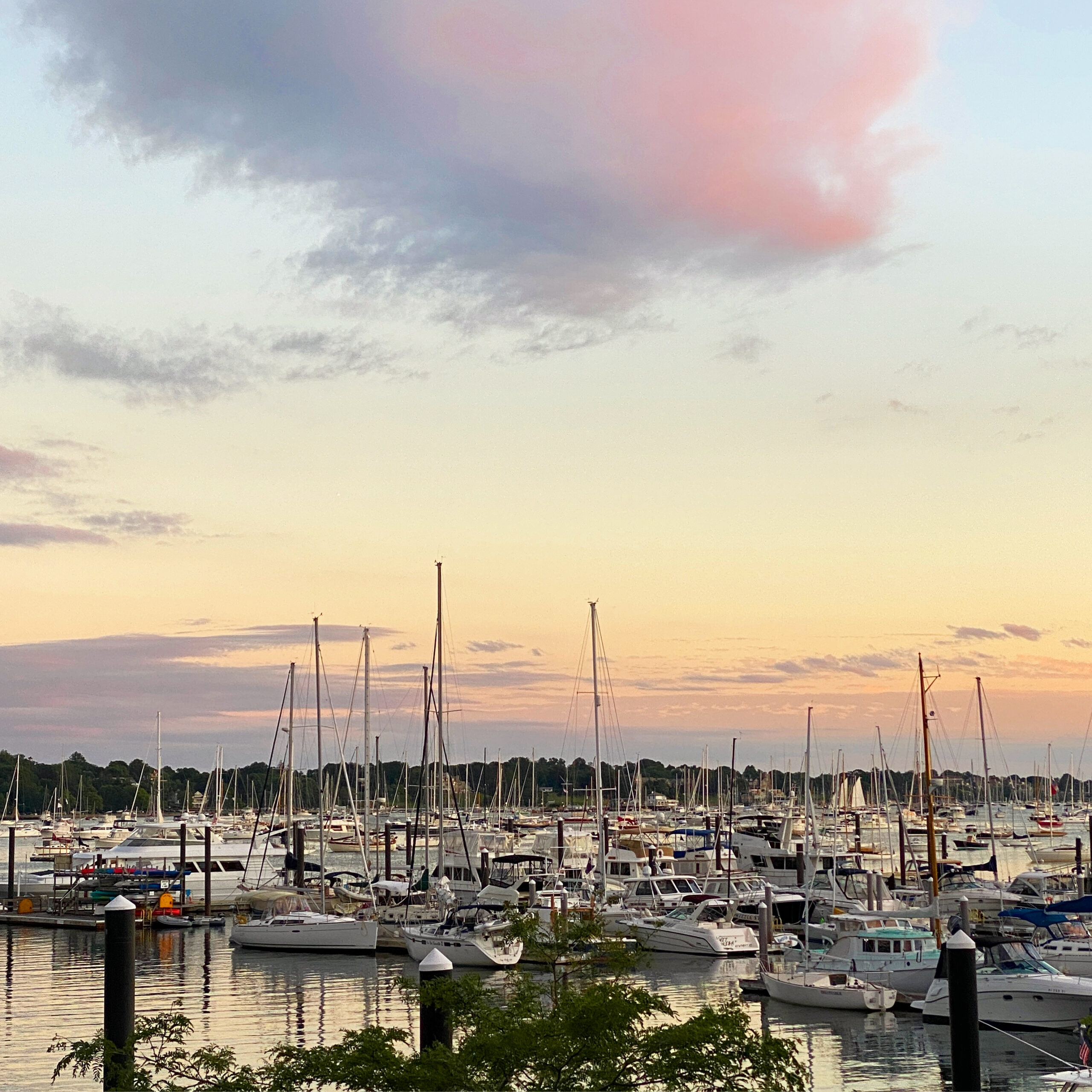 a view of Newport at sunset from the Brenton Rooftop